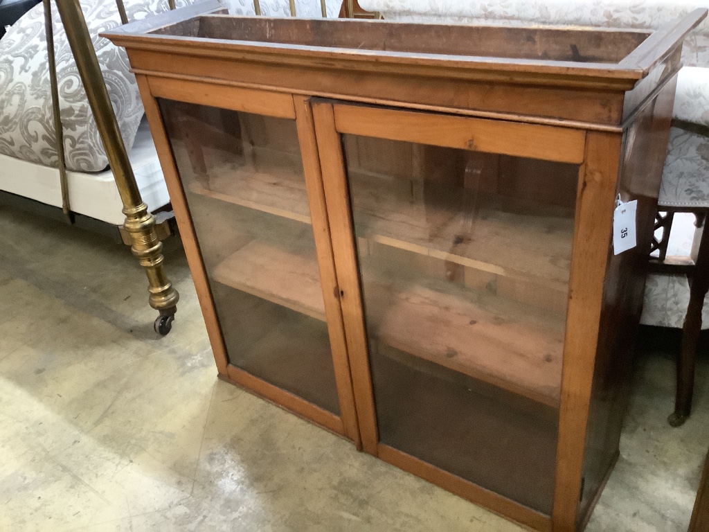 A Victorian glazed mahogany two door cabinet, width 100cm depth 31cm height 89cm